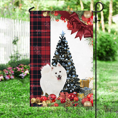 Japanese Spitz Flag Sitting In Front Of The Christmas Tree