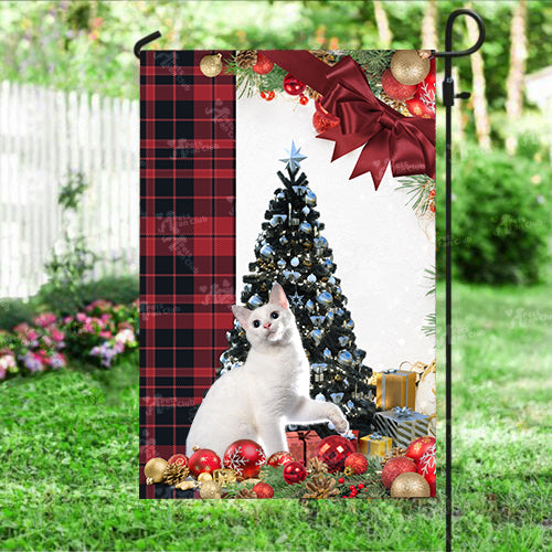 Japanese Bobtail Cat Flag Sitting In Front Of The Christmas Tree