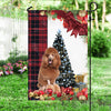 Brown Poodle Flag Sitting In Front Of The Christmas Tree