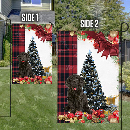 Black Labradoodle Flag Sitting In Front Of The Christmas Tree