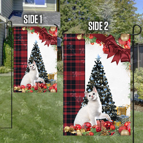 Japanese Bobtail Cat Flag Sitting In Front Of The Christmas Tree