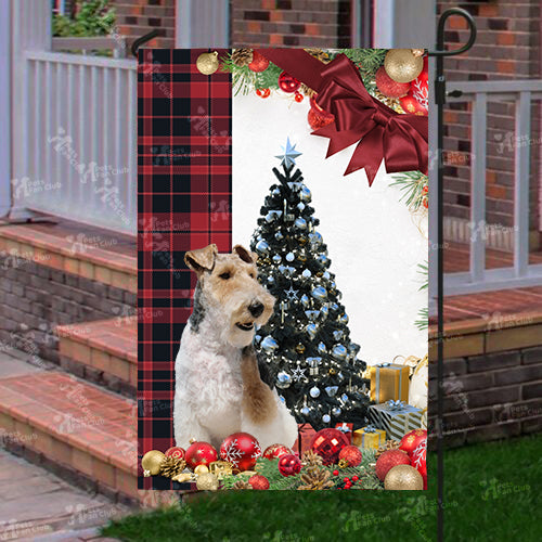 Fox Terrier Flag Sitting In Front Of The Christmas Tree