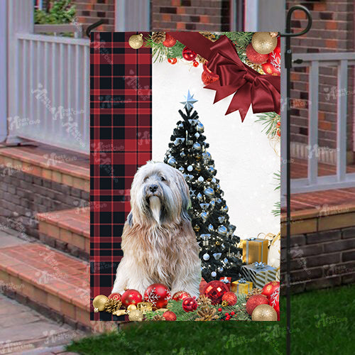 Tibetan Terrier Flag Sitting In Front Of The Christmas Tree