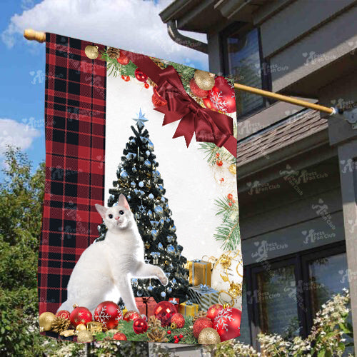 Japanese Bobtail Cat Flag Sitting In Front Of The Christmas Tree