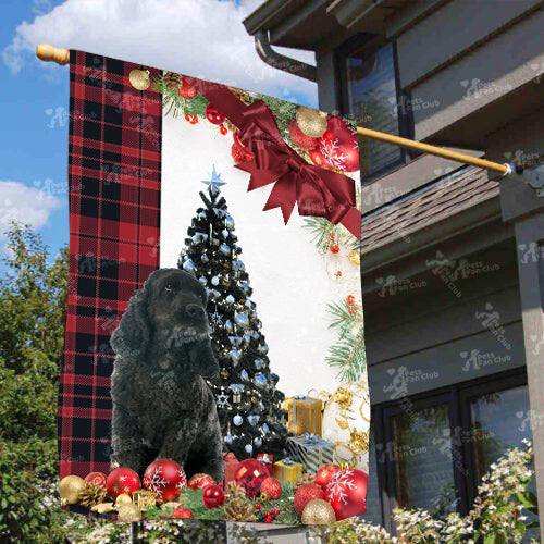 Black Cocker Spaniel Flag Sitting In Front Of The Christmas Tree