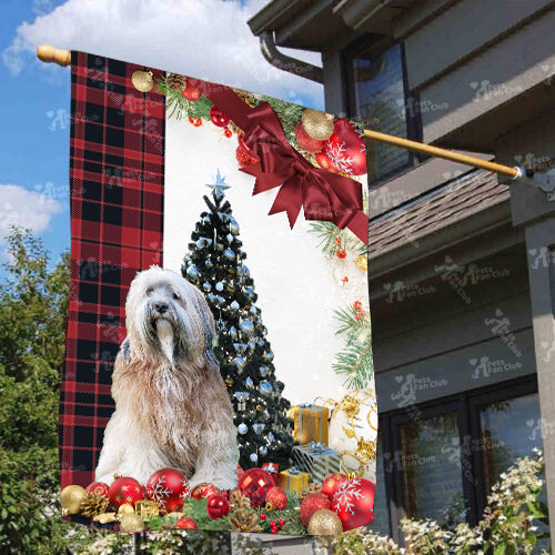 Tibetan Terrier Flag Sitting In Front Of The Christmas Tree